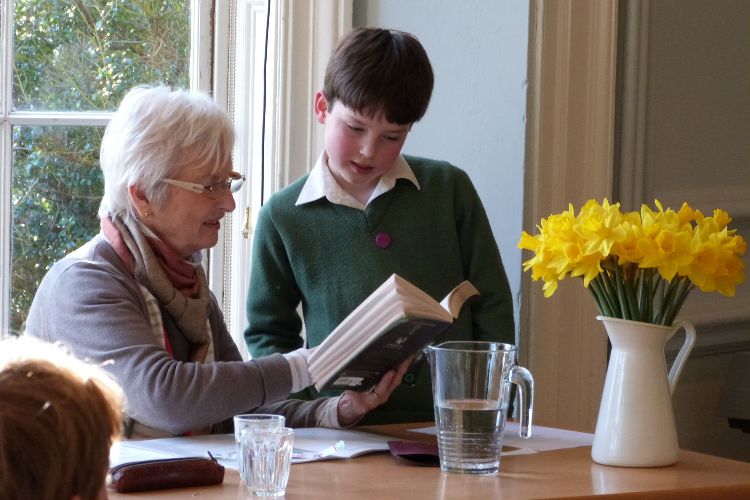 A teacher guiding a student